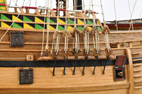 Image displaying the Amati Mayflower wooden model kit, featuring the detailed components and tools for assembling a historically accurate replica of the 17th-century Pilgrim ship, showcasing intricate craftsmanship and authentic design.