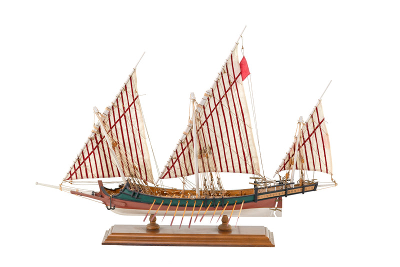 Photo of Amati Greek Galley 1:65 wooden model ship kit with sails and wooden base, depicting a historic Greek warship from the War of Independence.
