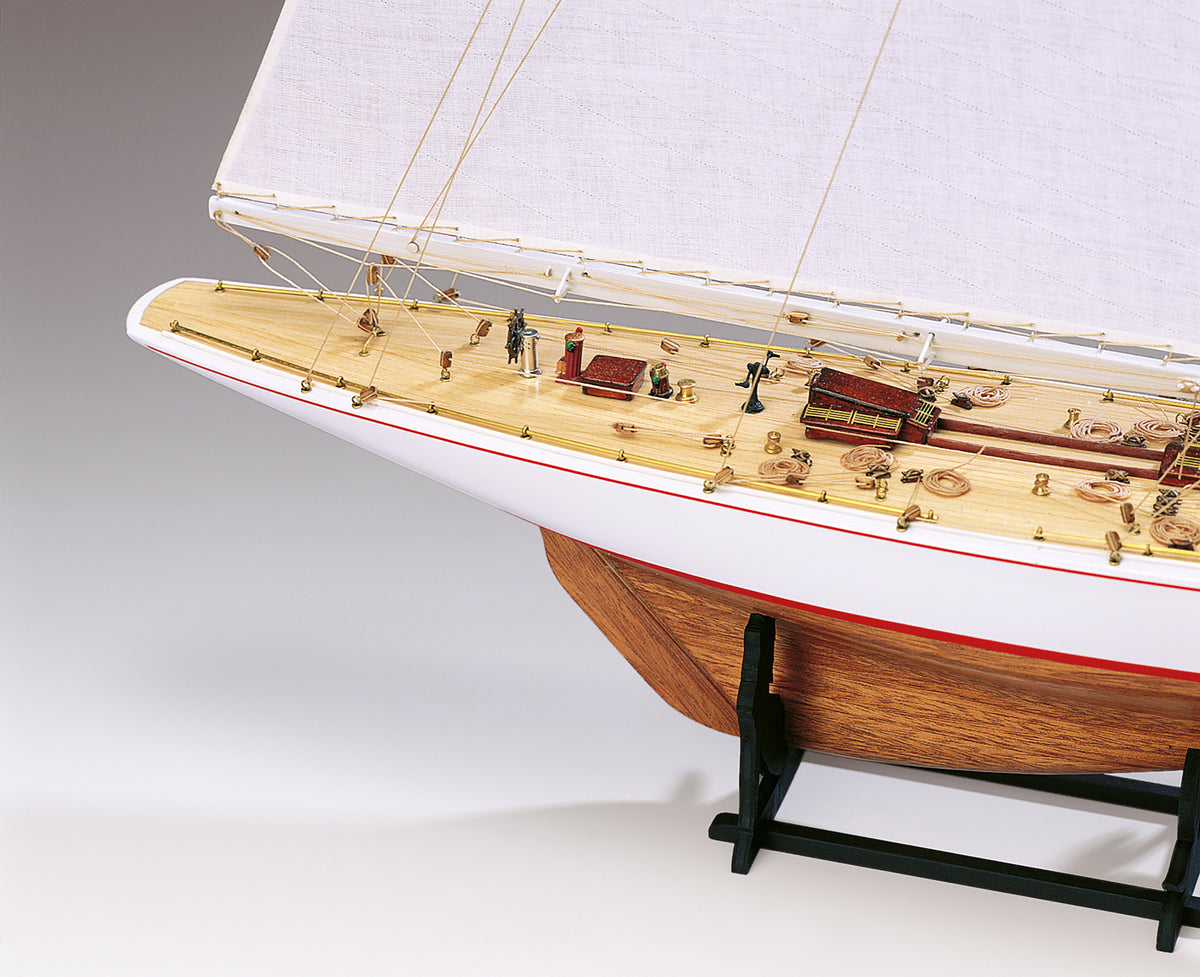 Photo of Amati Rainbow 1:80 scale wooden model yacht kit with sails, tools, and brass fittings
