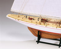 Photo of Amati Rainbow 1:80 scale wooden model yacht kit with sails, tools, and brass fittings
