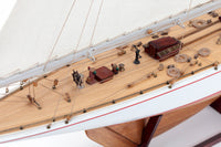 Photo of Amati Rainbow 1:80 scale wooden model yacht kit with sails, tools, and brass fittings