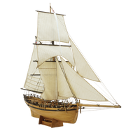 Photo of the HMS Rattlesnake 1776 wooden model kit by Shipyard in 1:72 scale, showing laser-cut parts, brass details, rigging accessories, and sails.