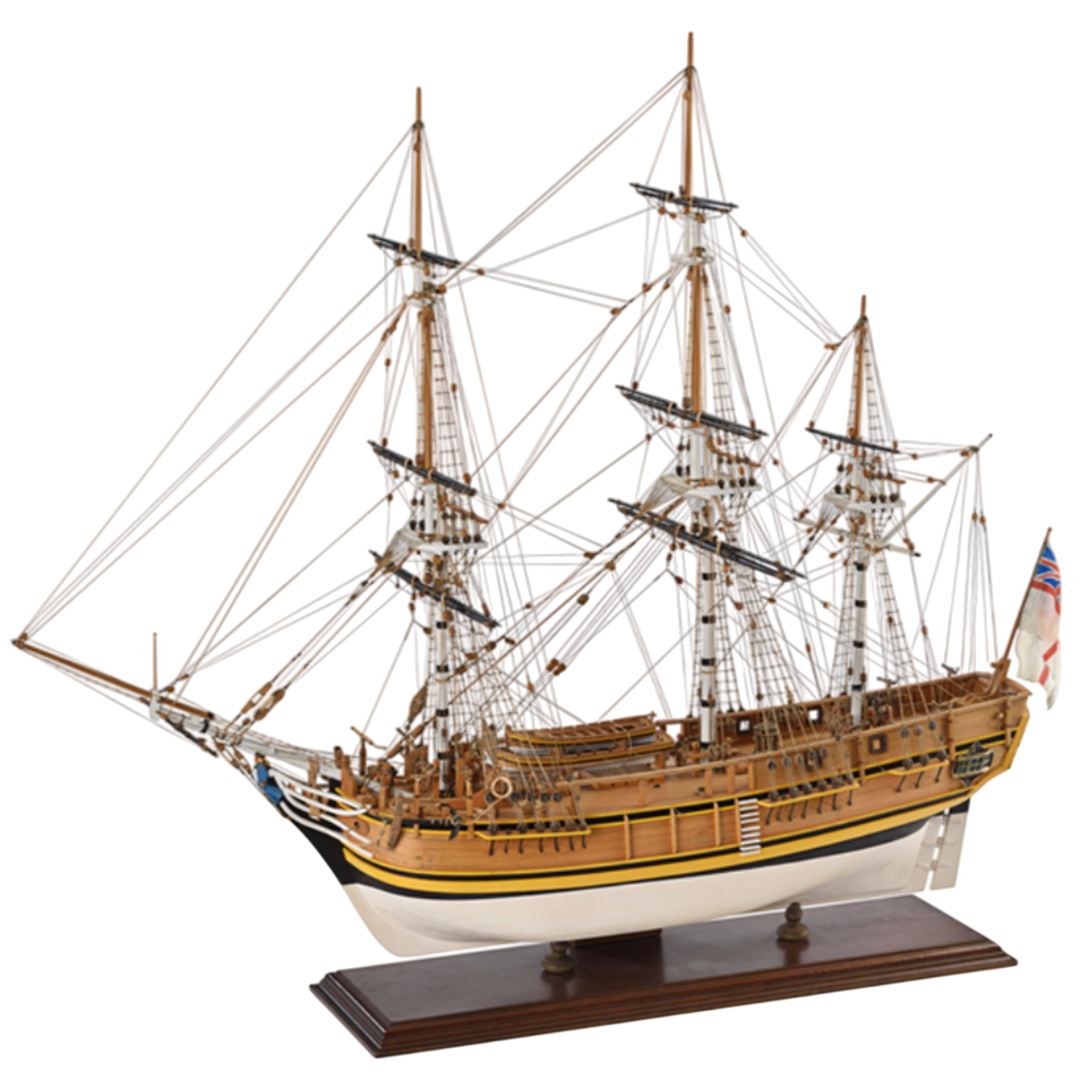 Image showcasing the Amati HMS Bounty wooden model kit, featuring detailed components for assembling a scale replica of the historic 18th-century British naval ship, complete with intricate rigging, sails, and deck structures.