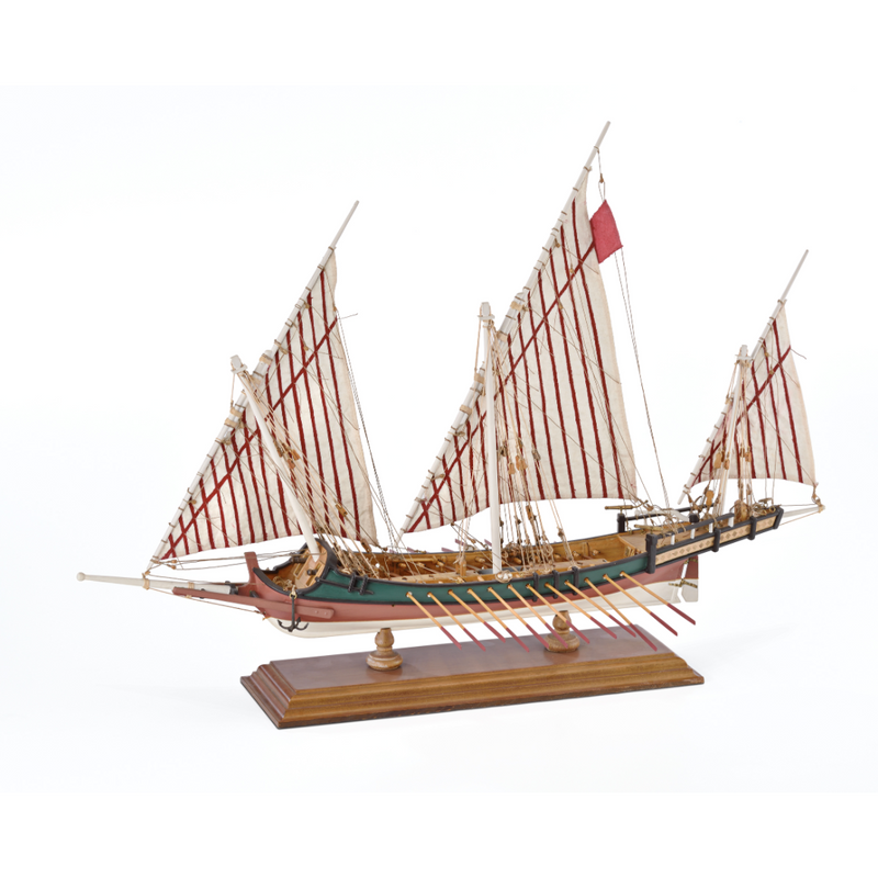 Photo of Amati Greek Galley 1:65 wooden model ship kit with sails and wooden base, depicting a historic Greek warship from the War of Independence.