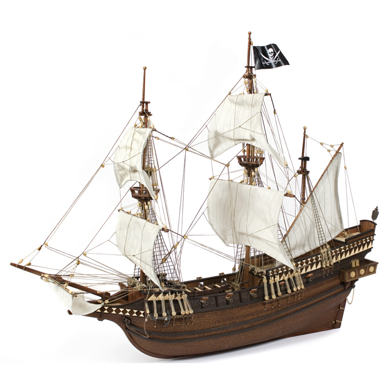 Photo of OcCre Buccaneer Pirate Ship 1:100 Wooden Model Kit fully assembled, showing detailed sails, wooden hull, and rigging.