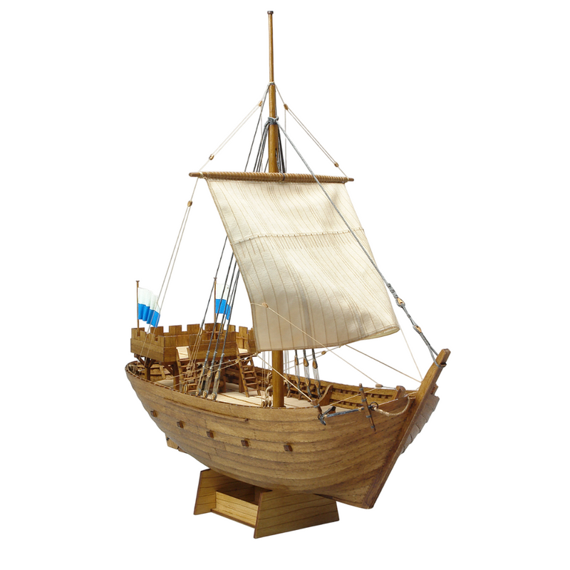 Photo of Kogge von Kampen 1336 model ship kit 1:72 by Shipyard (WM:003) with laser-cut wooden parts, sails, rigging, and painting accessories.
