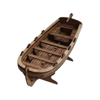 Photo of Wooden Model Kit Rowing Boat Scale 1:72 by ModelNet – parts and instructions displayed.
