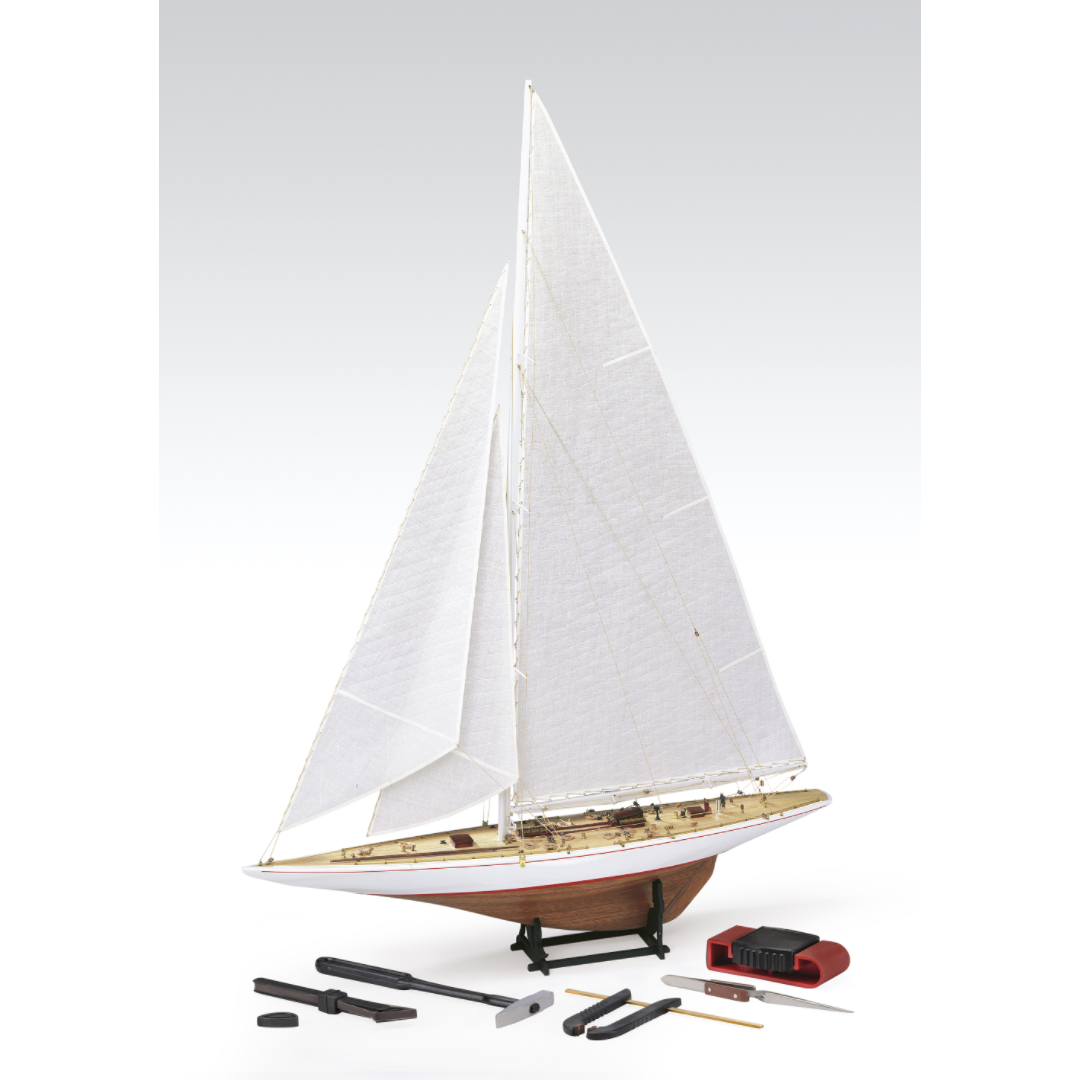 Photo of Amati Rainbow 1:80 scale wooden model yacht kit with sails, tools, and brass fittings