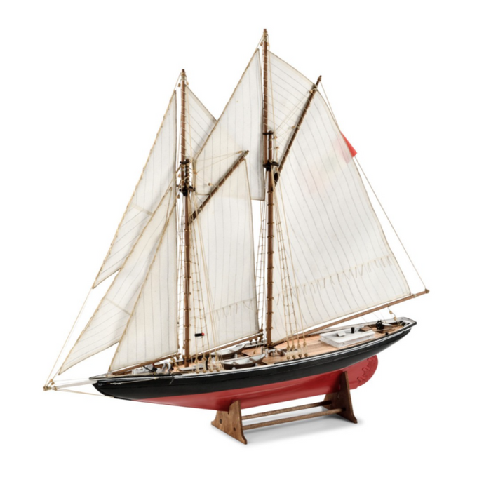 Image showcasing Amati's Bluenose wooden model kit, featuring intricate parts and assembly tools for creating a detailed scale replica of the famous racing schooner, known for its precision craftsmanship and authentic design.