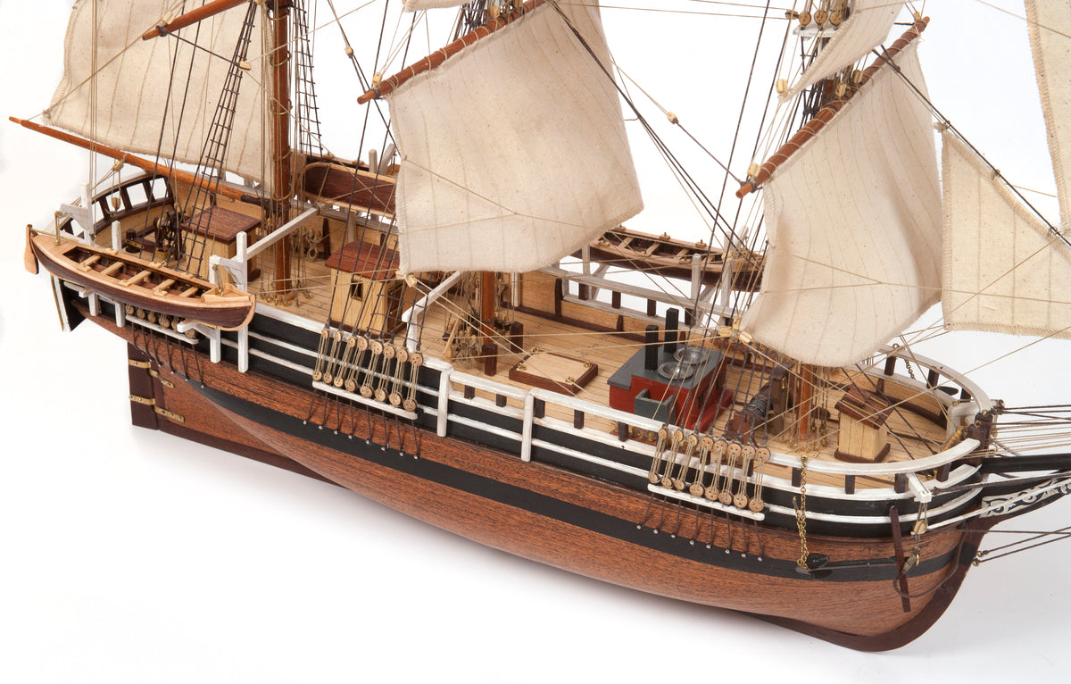 Photo of OcCre Essex 1:60 scale wooden model ship kit with detailed rigging and historical design