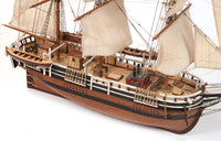 Photo of OcCre Essex 1:60 scale wooden model ship kit with detailed rigging and historical design