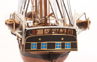 Photo of OcCre Essex 1:60 scale wooden model ship kit with detailed rigging and historical design