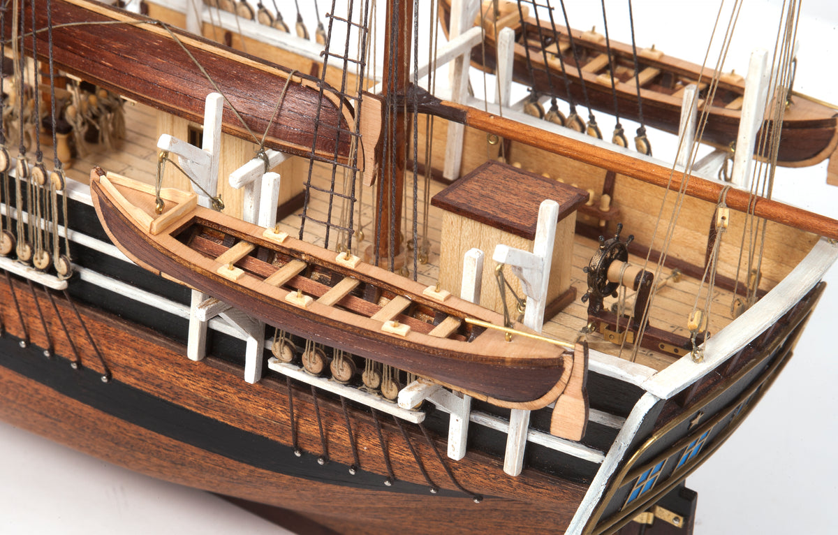 Photo of OcCre Essex 1:60 scale wooden model ship kit with detailed rigging and historical design