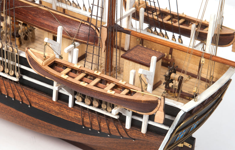 Photo of OcCre Essex 1:60 scale wooden model ship kit with detailed rigging and historical design