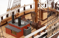 Photo of OcCre Essex 1:60 scale wooden model ship kit with detailed rigging and historical design