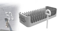 Gray nail holder with nails on a white background