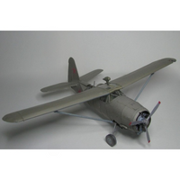 A scale model of a Soviet military aircraft, likely a Yak-150, in a matte gray livery with small red star insignias on the tail, photographed on a neutral gray background.