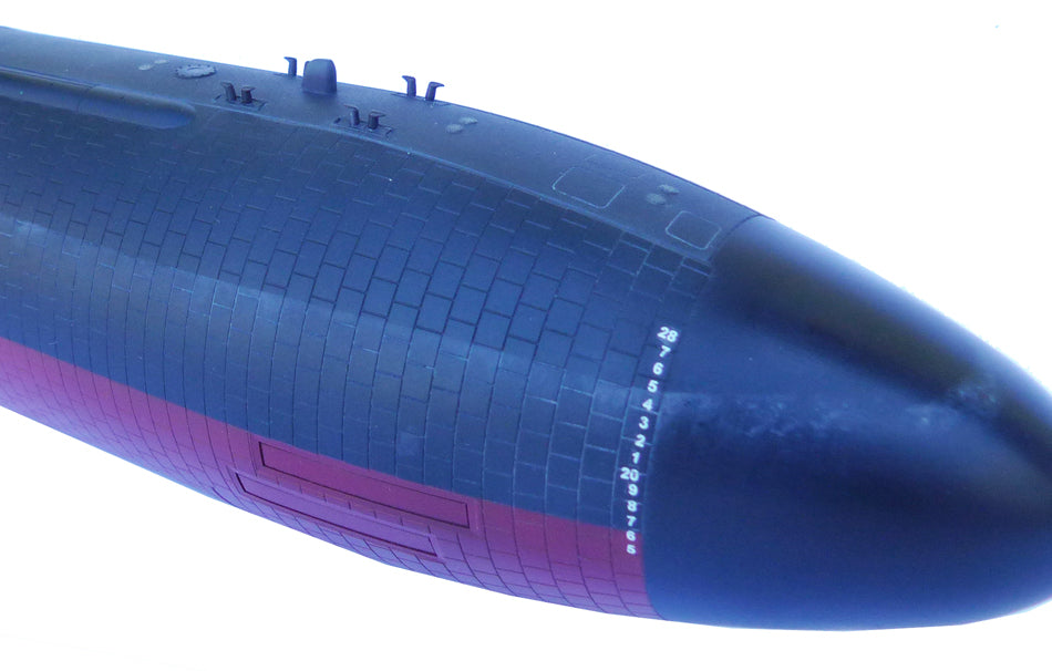 Close-up of a blue submarine on a white background