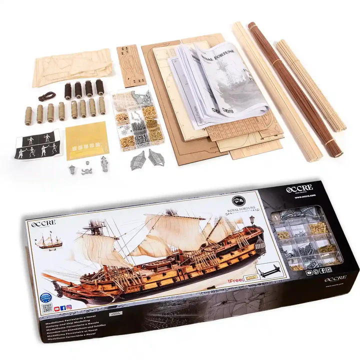 Wooden ship model kit with components and packaging on a white background