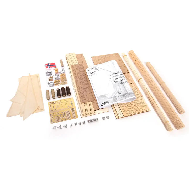 A wooden model kit laid out on a white background, including natural wood dowels, wooden planks, metal hardware, small flags, and a printed instruction booklet.