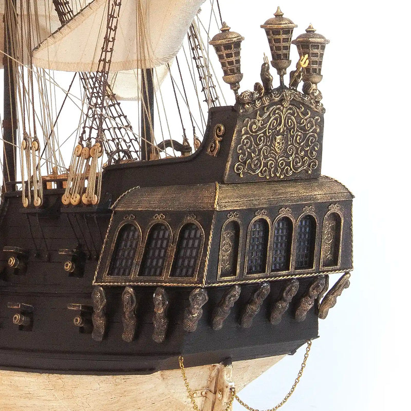 Photo of OcCre Black Swan wooden model ship kit 1:75 scale, detailed pirate vessel with sails and nameplate