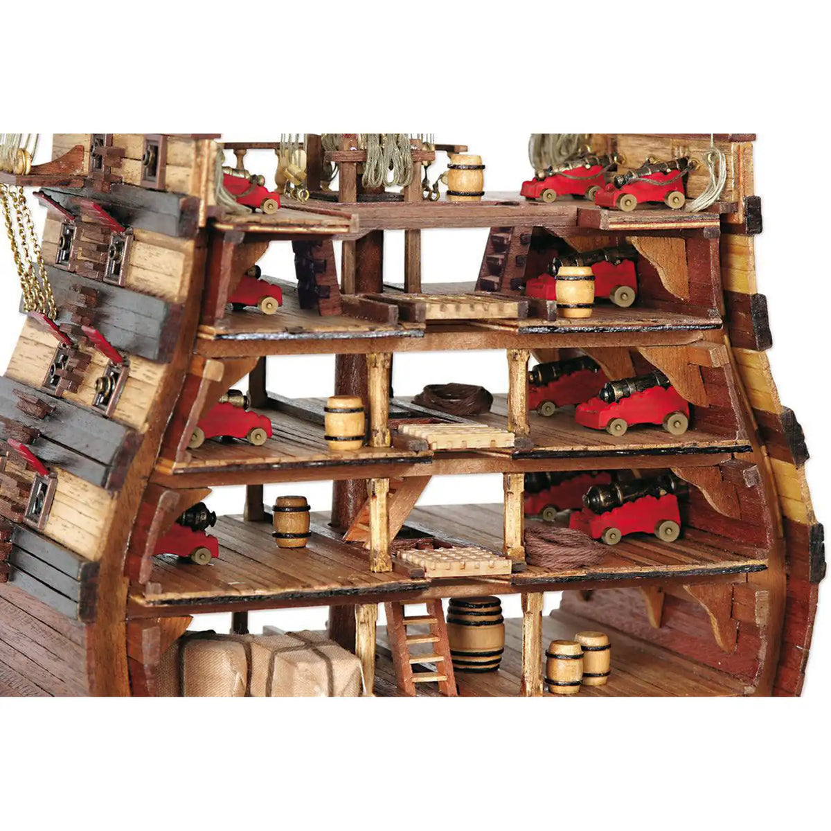 Photo of the Santísima Trinidad cross-section model kit by OcCre in 1/90 scale, showcasing detailed inner ship structure and mainmast elements.