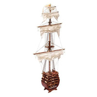 Photo of the Santísima Trinidad cross-section model kit by OcCre in 1/90 scale, showcasing detailed inner ship structure and mainmast elements.