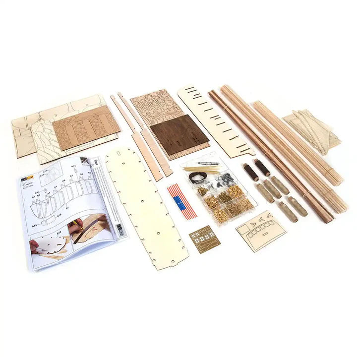 Photo of OcCre Essex 1:60 scale wooden model ship kit with detailed rigging and historical design