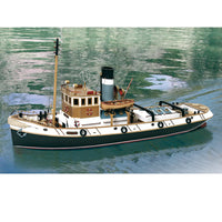 Photo of the Ulises Tug Boat Model Kit (1:30 Scale) by OcCre (61001), a detailed wooden and metal ship model featuring a steel hull, wooden crew areas, and intricate maritime details.