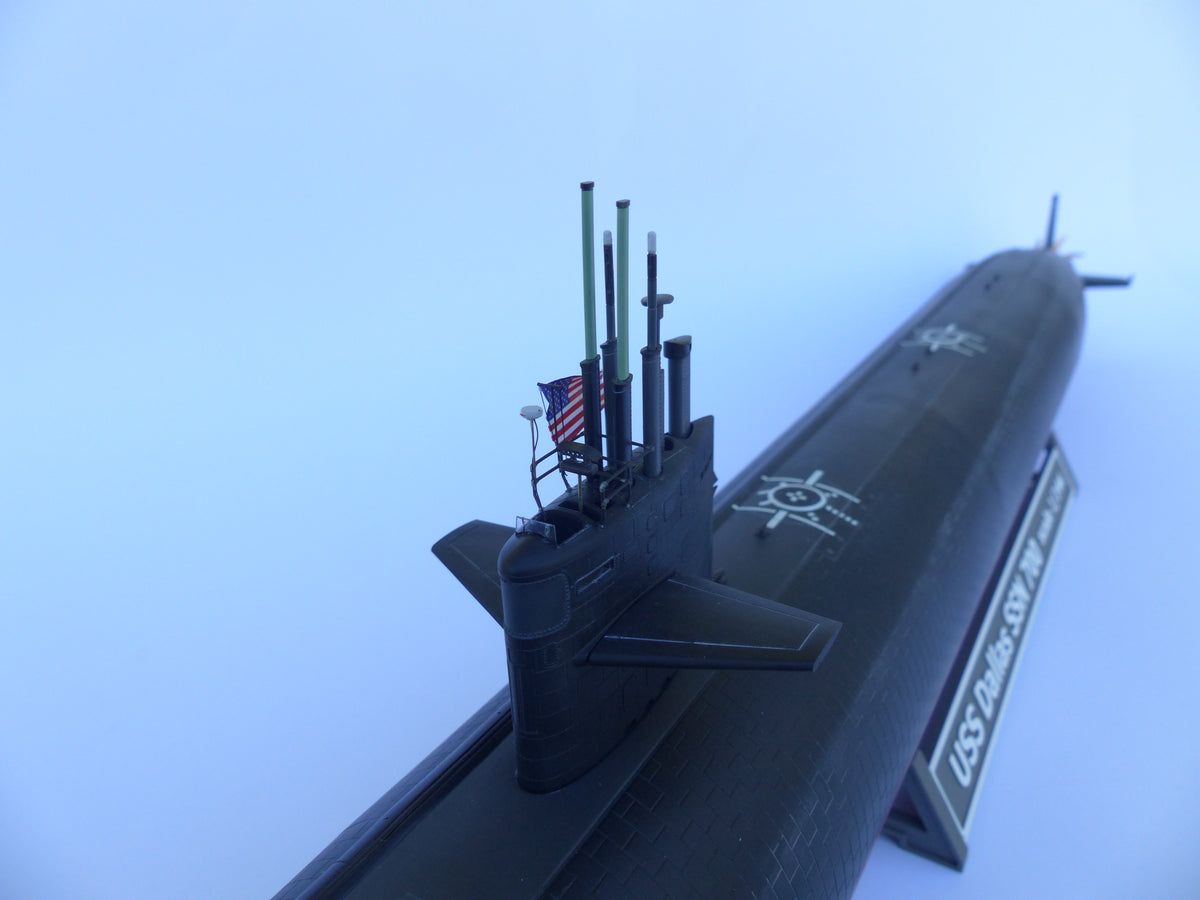 Model of a submarine on a light blue background