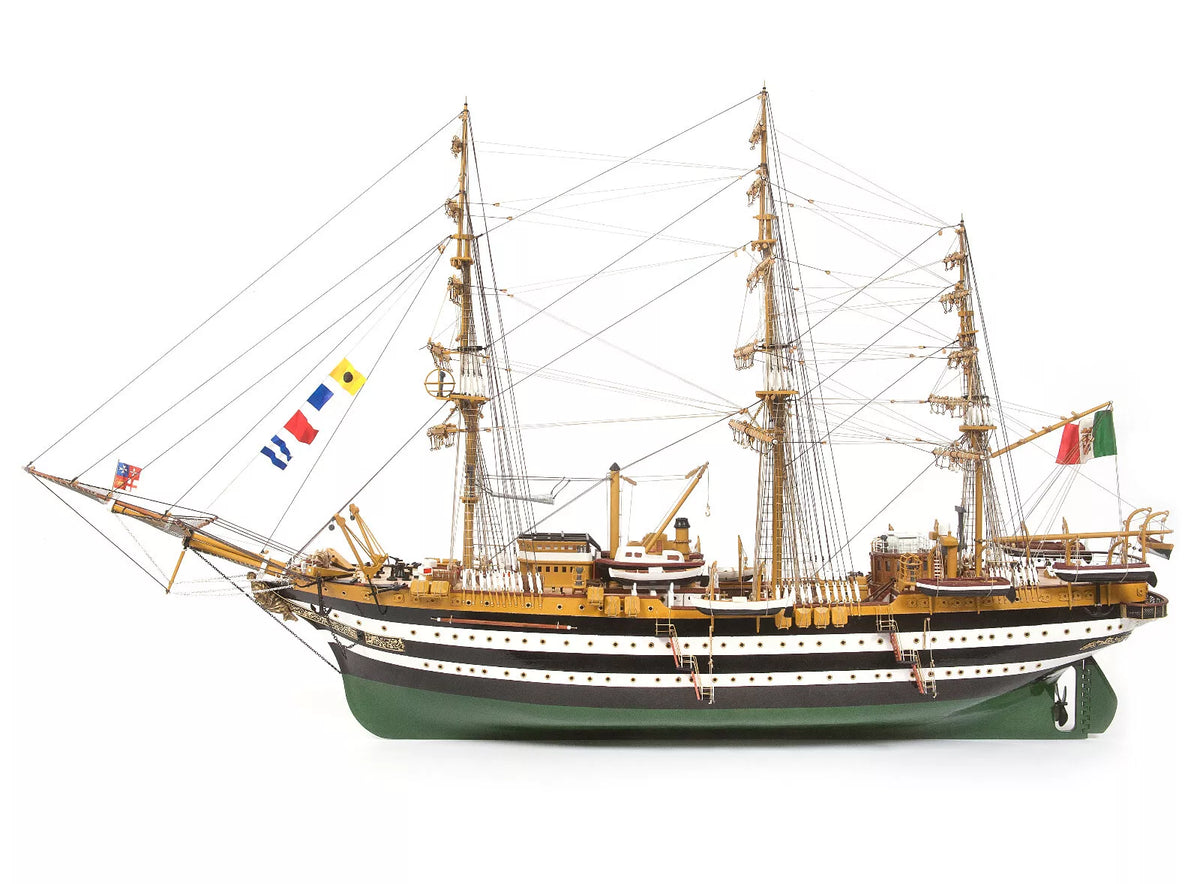 Photo of OcCre Amerigo Vespucci 1:100 wooden model ship kit without sails, showing detailed hull and brass photo-etch parts.