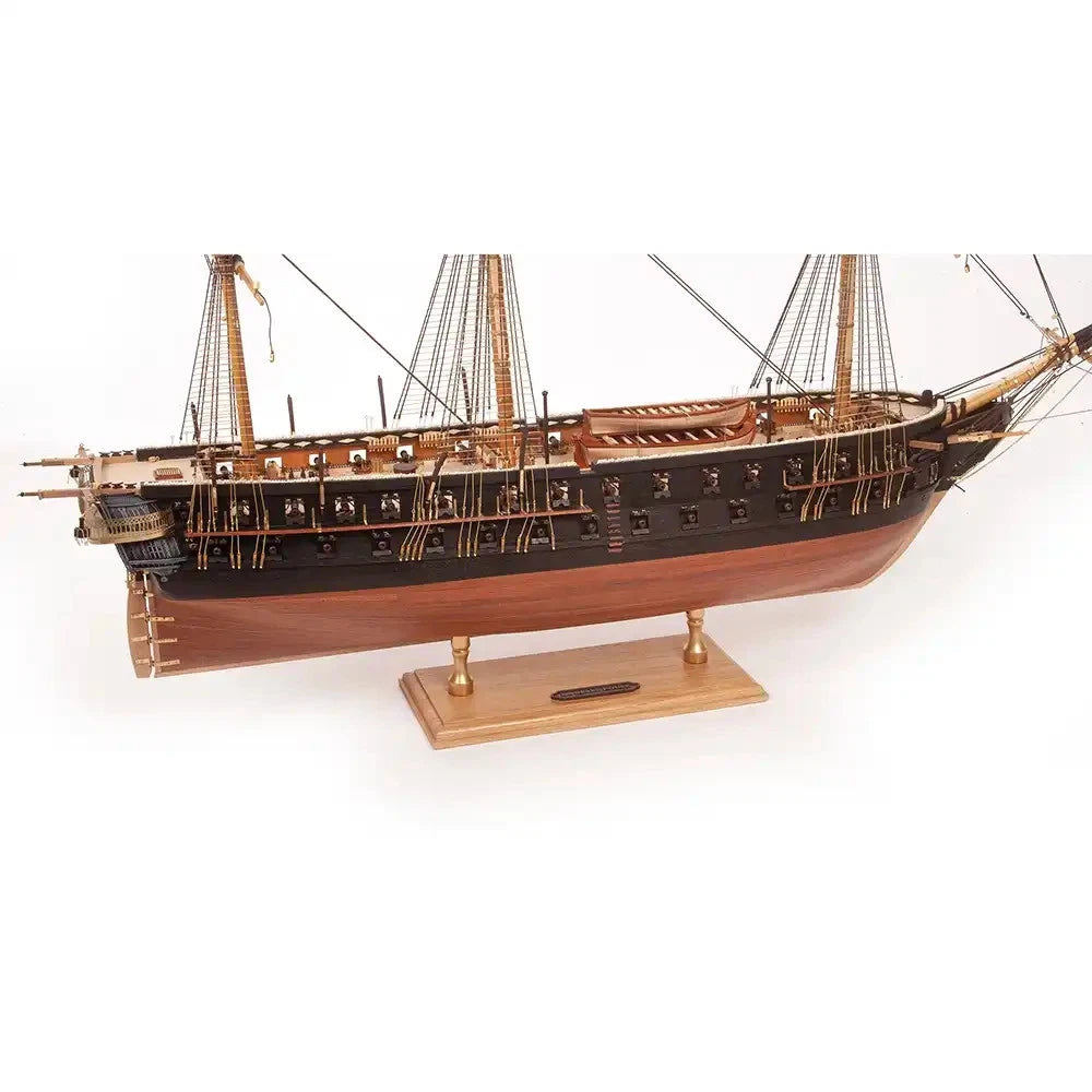 Photo of the OcCre 19164 Solid Oak Ship Model Display Base with two brass brackets, measuring 250x120x15mm, ideal for showcasing ship models.