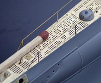 Photo of photo-etched brass parts upgrade set for German U-Boat Type IIB 1:144 scale by Revell and ICM, featuring railings, ladders, and deck details.