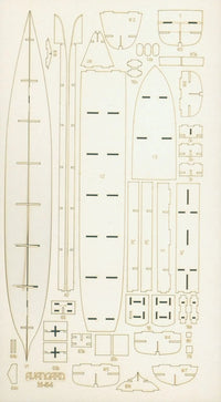 A sheet of light wood or cardboard template pieces laid out flat on a white background, showing multiple pre-cut sections with printed labels and markings for assembling a long, narrow boat or canoe.