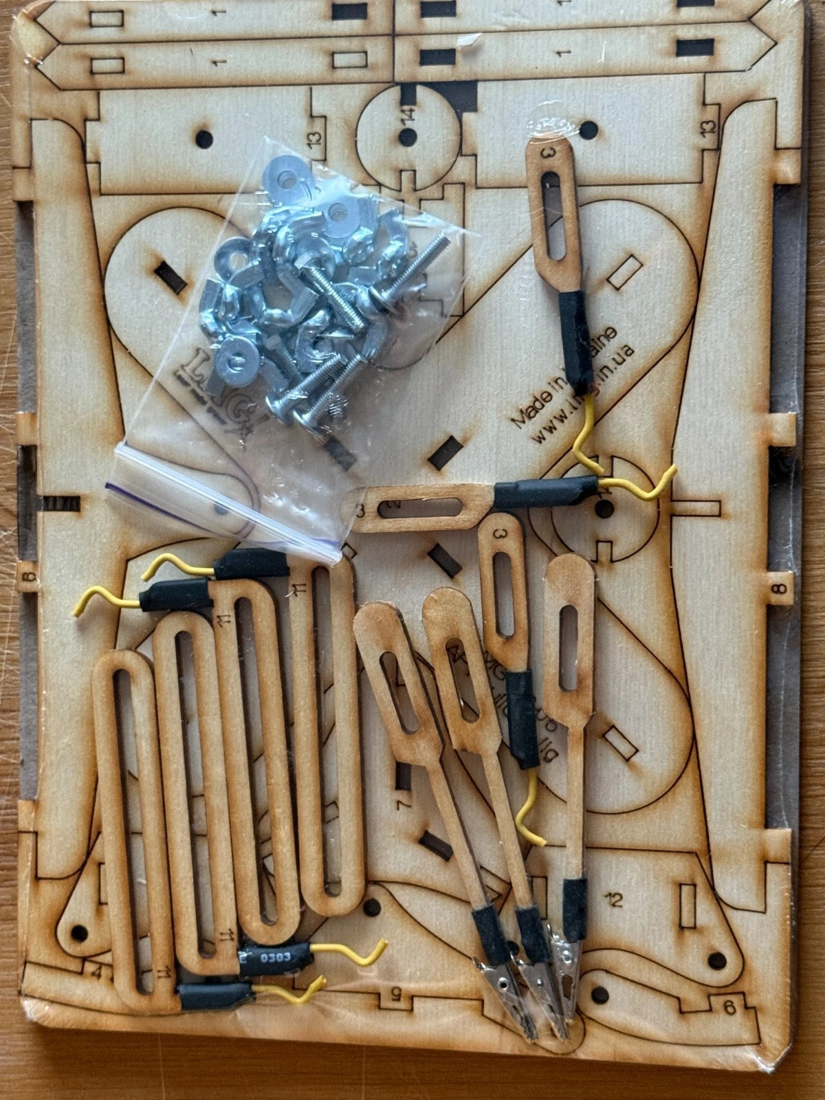 Photo of LMG BB-05 armored vehicle model assembly jig with cross base