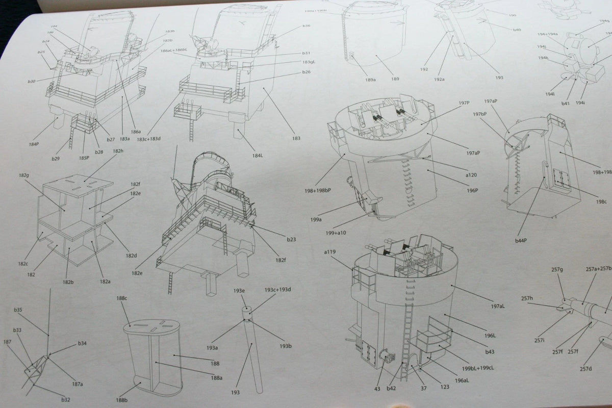 A printed technical schematic sheet showing multiple black-and-white exploded line drawings of cylindrical and rectangular mechanical components with numbered callouts on a white background.