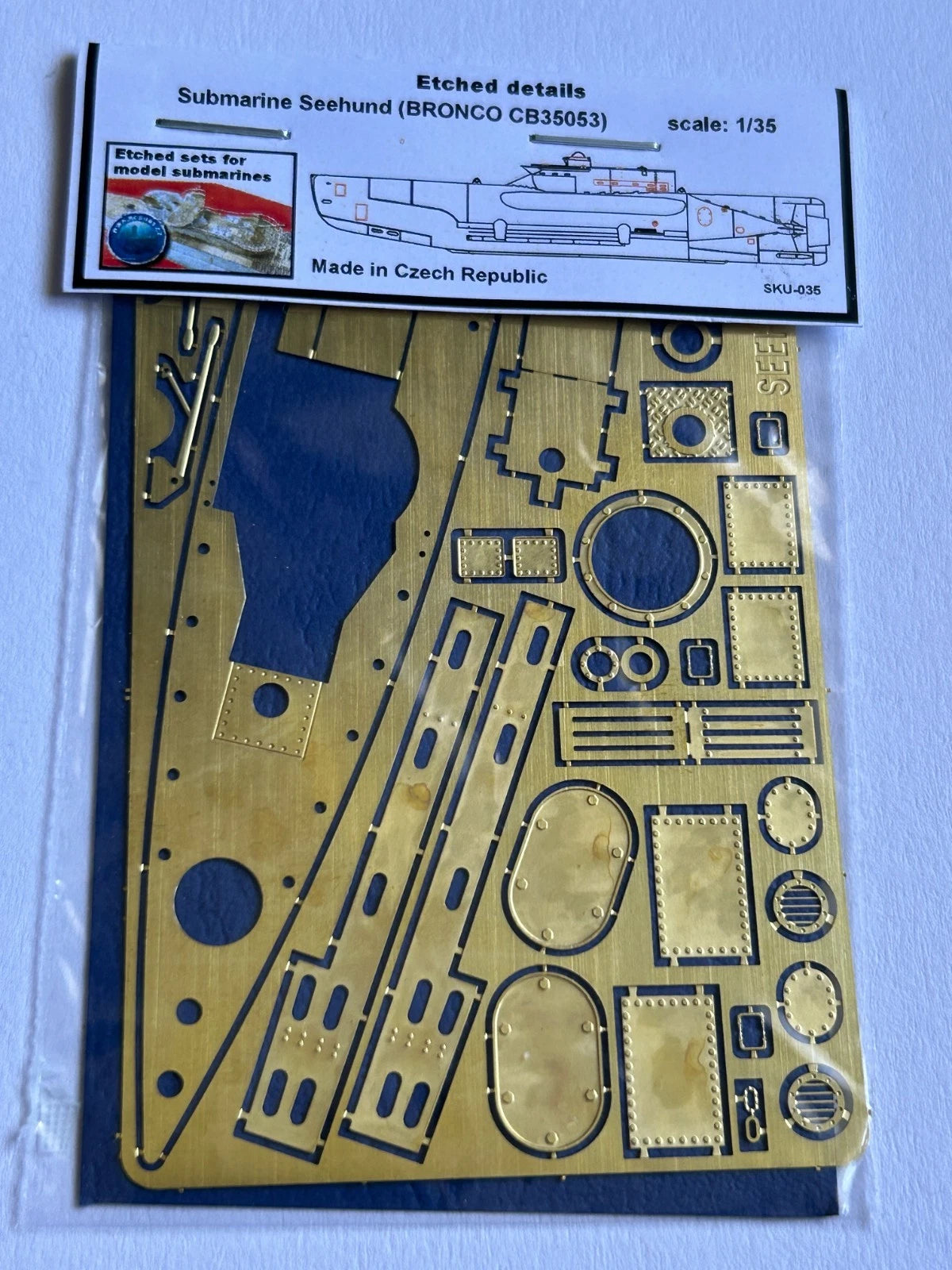Photo of 1:35 scale photo-etched brass detail set for German U-Boat Type Seehund Bronco CB35053, showing deck, railings, and conning tower parts.