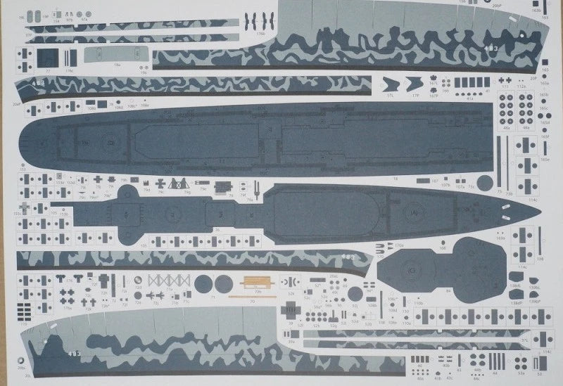 A sheet of model kit decals or transfer sheets featuring gray camouflage patterns and dark blue-gray ship or submarine-like silhouette shapes on a white backing.