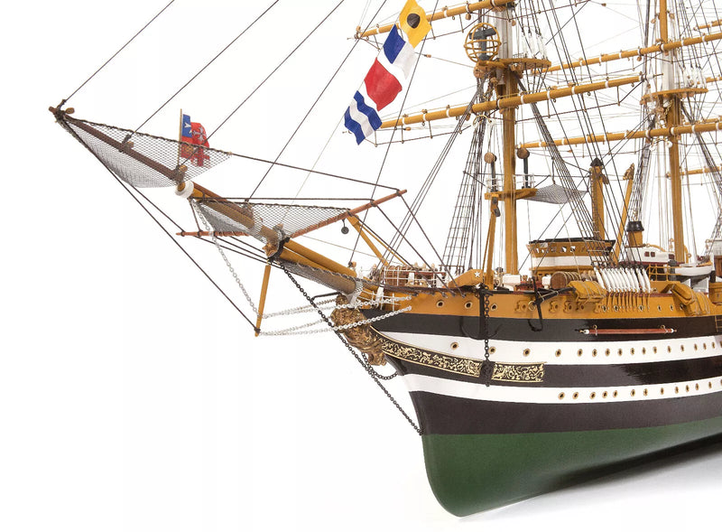 Photo of OcCre Amerigo Vespucci 1:100 wooden model ship kit without sails, showing detailed hull and brass photo-etch parts.