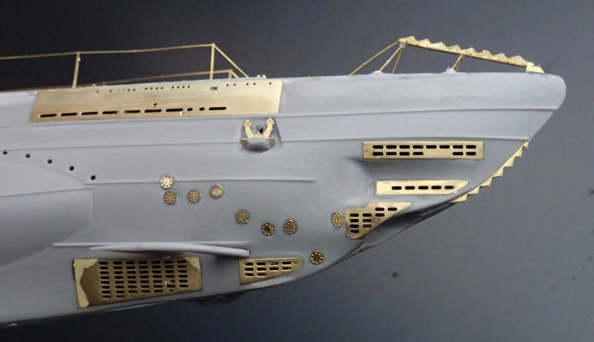 Photo of photo-etched brass parts upgrade set for German U-Boat Type IIB 1:144 scale by Revell and ICM, featuring railings, ladders, and deck details.