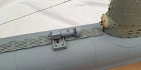 Photo of photo-etched brass detail set for German U-Boat Type XXIII in 1:72 scale, showing deck, railings, and conning tower parts.