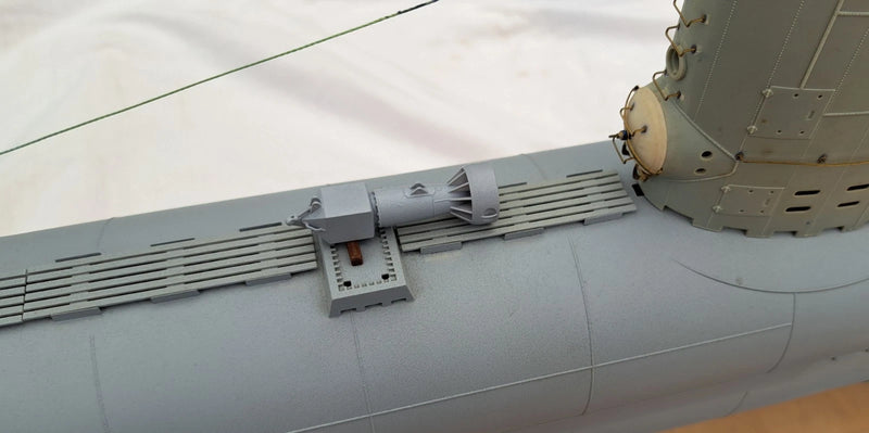 Photo of photo-etched brass detail set for German U-Boat Type XXIII in 1:72 scale, showing deck, railings, and conning tower parts.