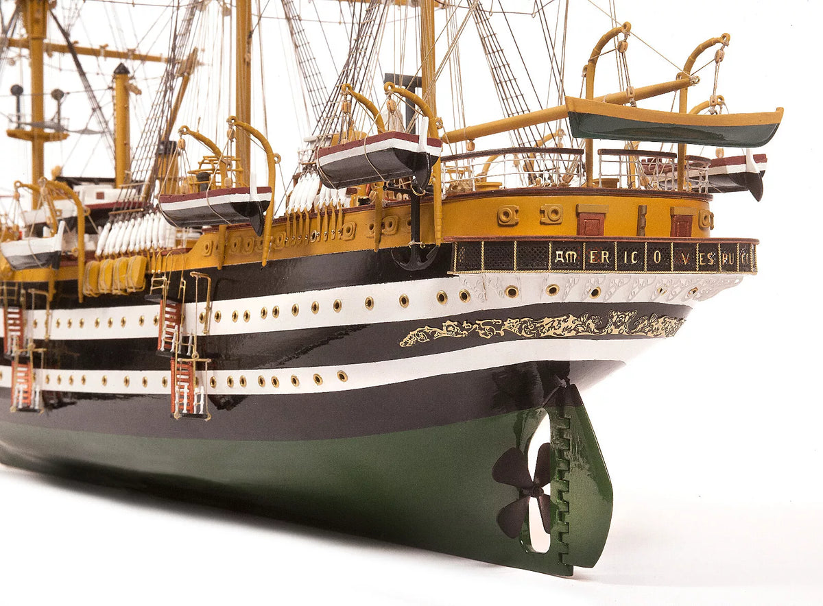 Photo of OcCre Amerigo Vespucci 1:100 wooden model ship kit without sails, showing detailed hull and brass photo-etch parts.