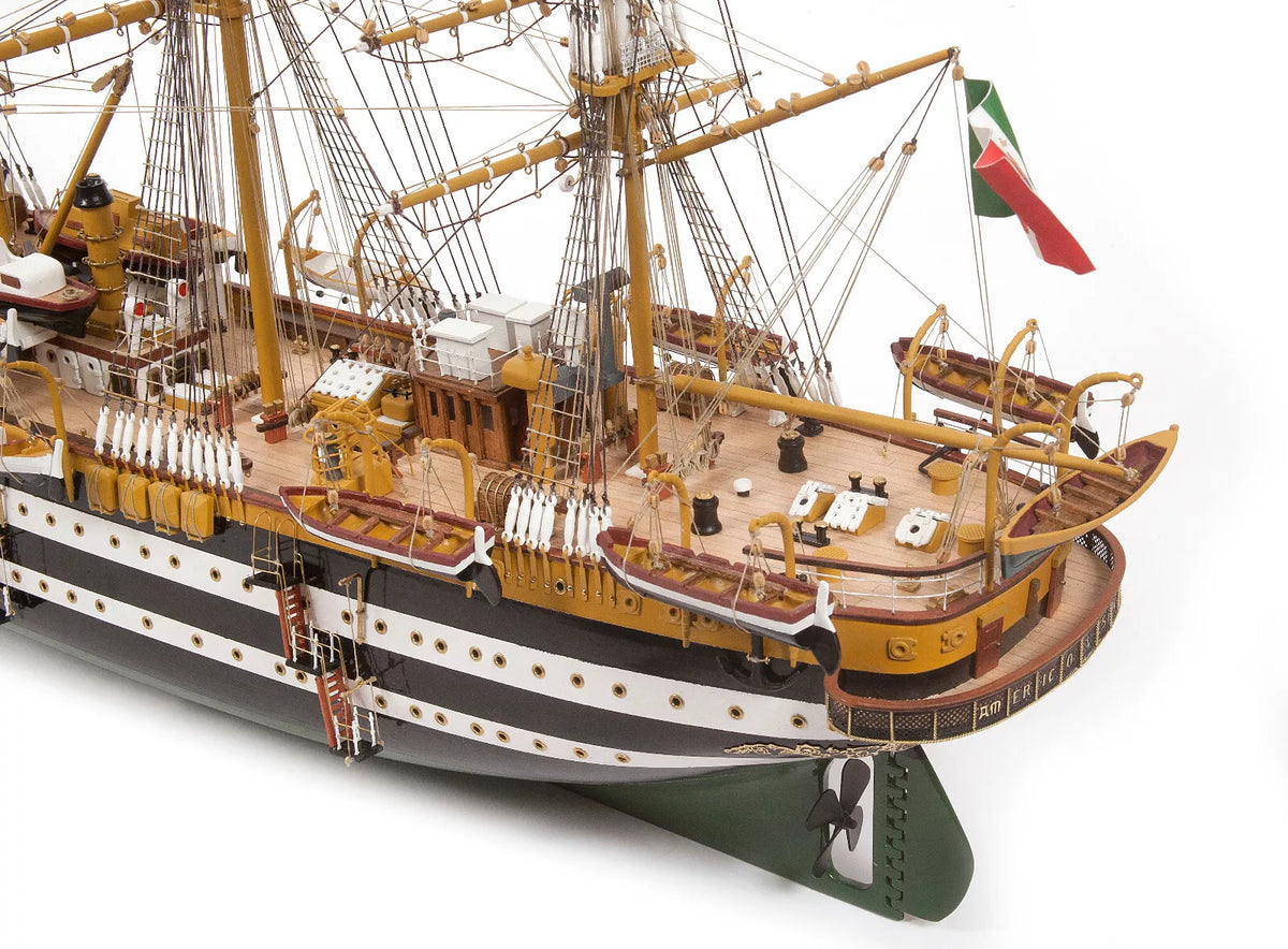 Photo of OcCre Amerigo Vespucci 1:100 wooden model ship kit without sails, showing detailed hull and brass photo-etch parts.