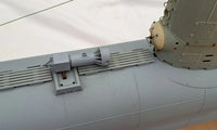 Photo of photo-etched brass detail set for German U-Boat Type XXIII in 1:72 scale, showing deck, railings, and conning tower parts.