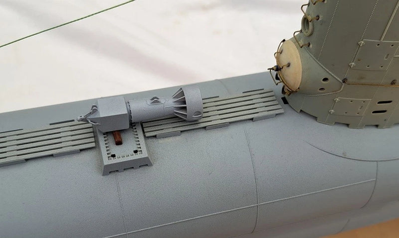 Photo of photo-etched brass detail set for German U-Boat Type XXIII in 1:72 scale, showing deck, railings, and conning tower parts.