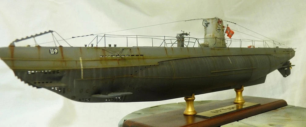 Photo of photo-etched brass parts upgrade set for German U-Boat Type IIB 1:144 scale by Revell and ICM, featuring railings, ladders, and deck details.