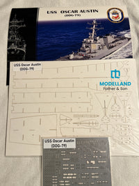 Model kit parts sheet for the USS Oscar Austin (DDG-79) from Modelland Father & Son, showing the printed layout sheet and a gray decal sheet on a white fabric background.