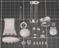 Photo of photo-etched brass detail set for German U-Boat Type XXIII in 1:72 scale, showing deck, railings, and conning tower parts.