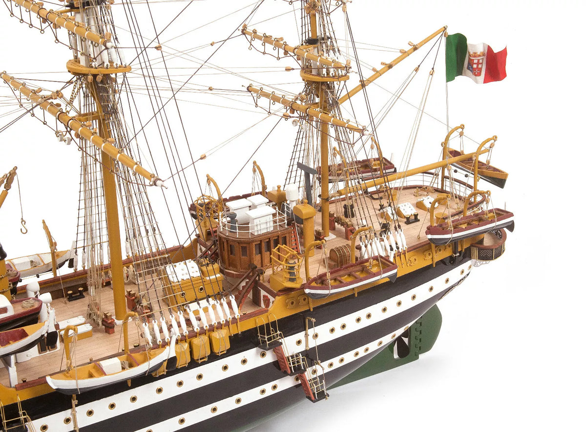 Photo of OcCre Amerigo Vespucci 1:100 wooden model ship kit without sails, showing detailed hull and brass photo-etch parts.